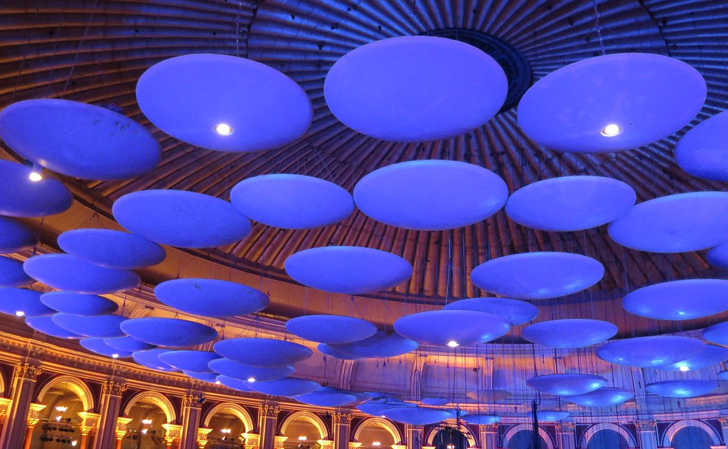 Suspended acoustic baffle ceiling clouds installed in a UAE office with exposed ceiling services
