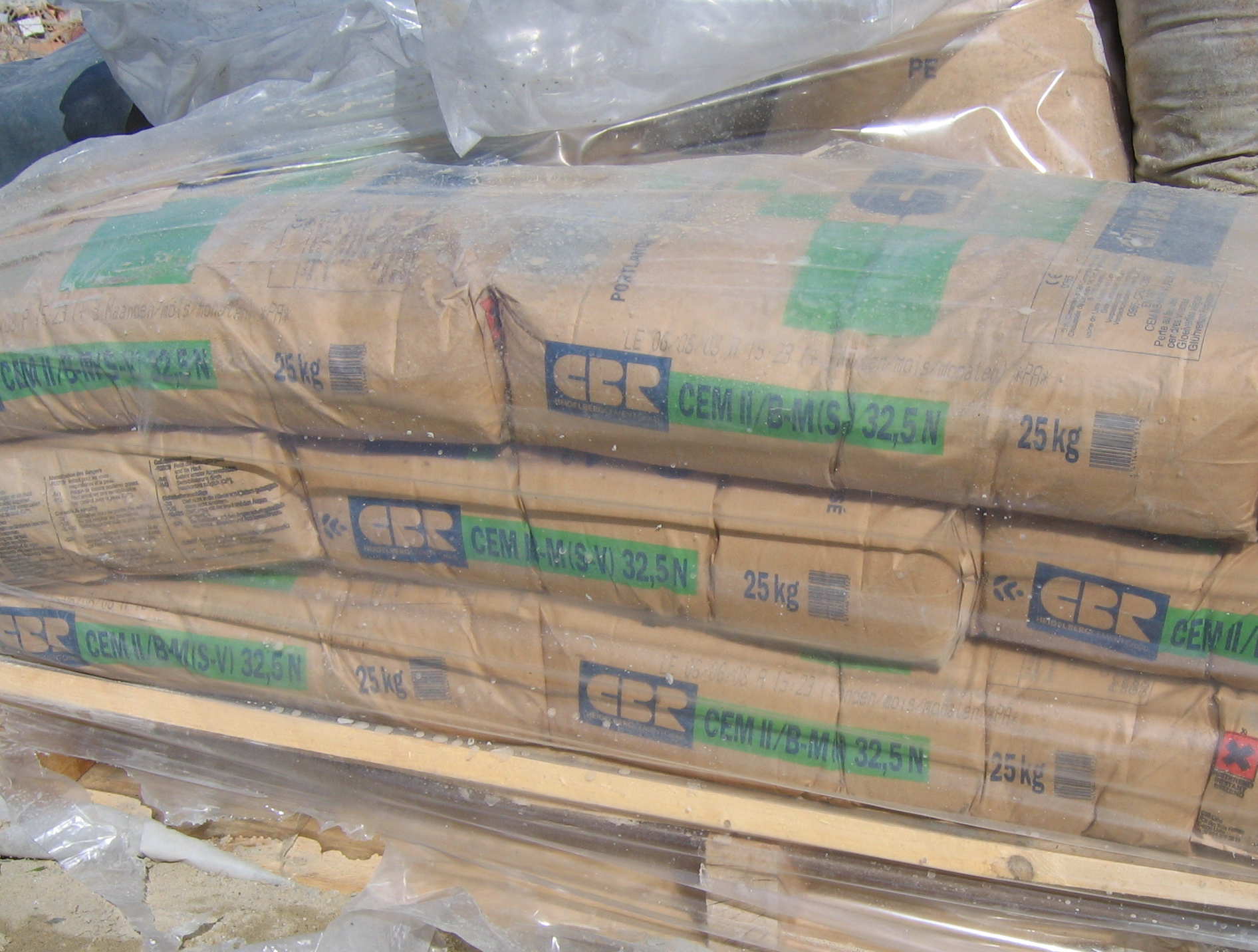 Stacked cement bags ready for dispatch at a building materials supply yard
