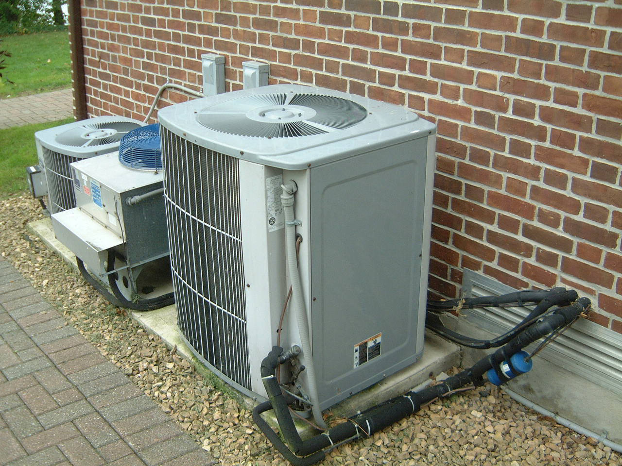 Closed-cell elastomeric foam insulation applied to an air conditioning refrigerant pipe to prevent condensation and heat loss