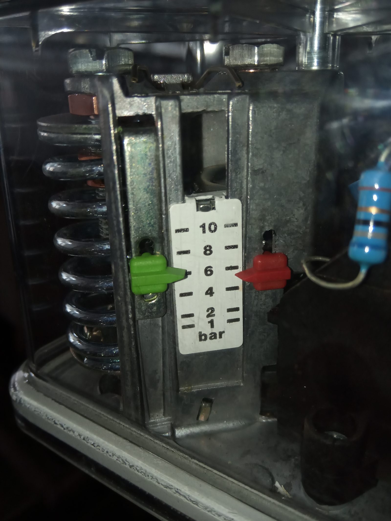 Close-up of an adjustable pressure switch used to control a domestic water pump's on and off cycling
